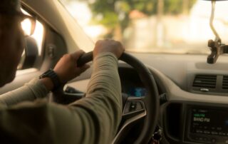 Man behind the wheel of a car